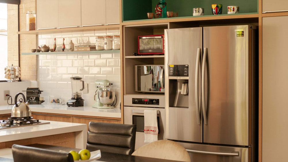 A kitchen with a french door refrigerator with an ice maker