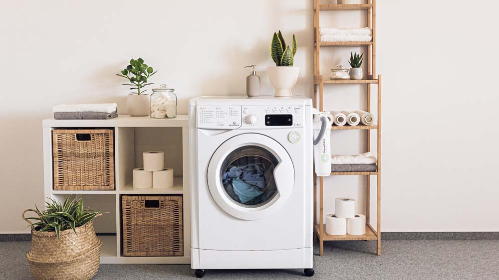 A laundry room with a front-loading clothes washer